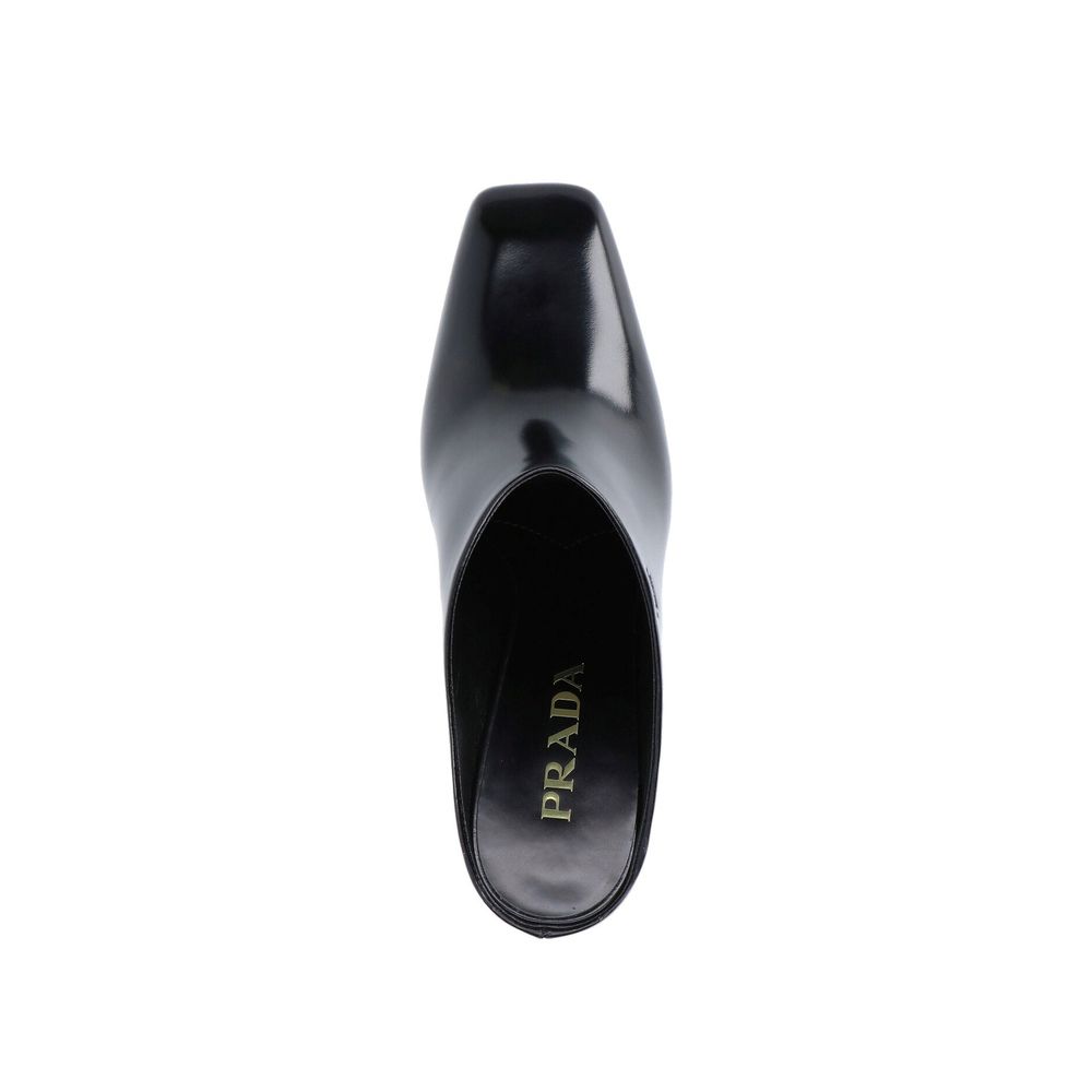 Mules en cuir de veau noir Prada