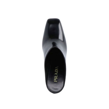 Mules en cuir de veau noir Prada
