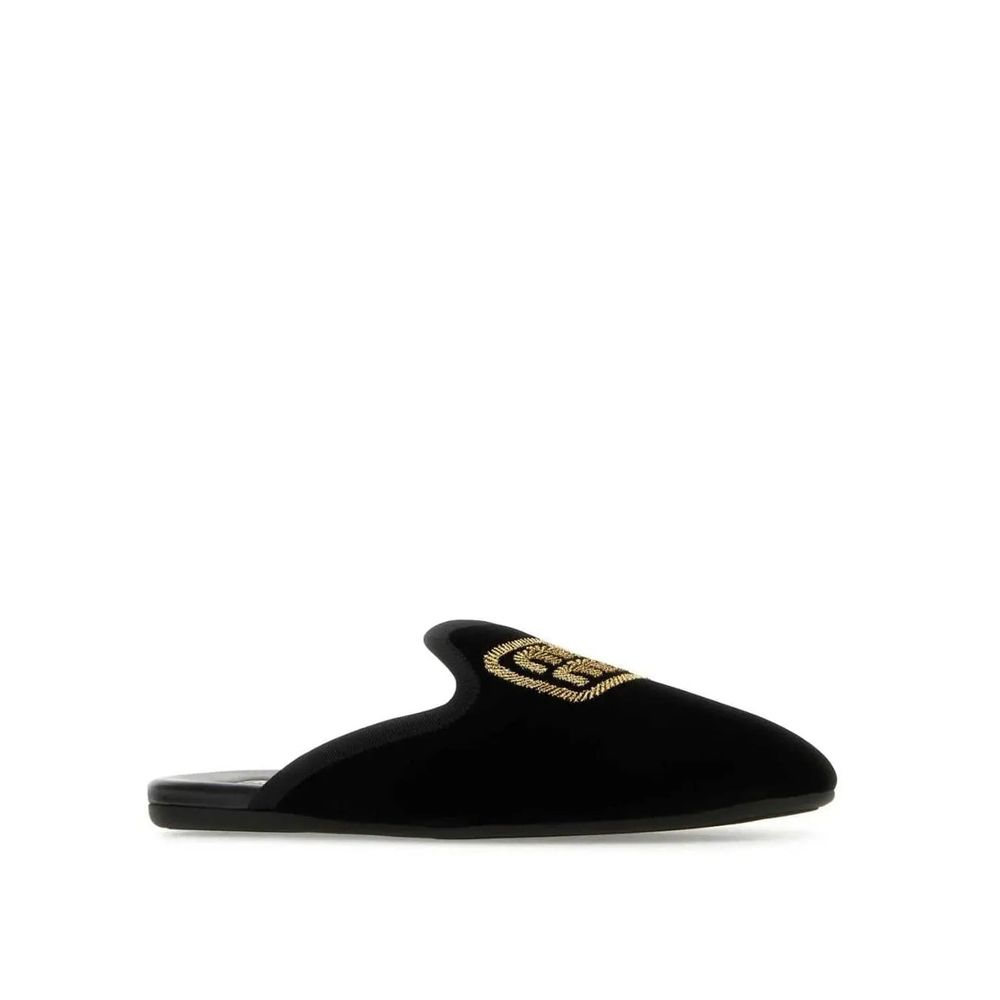 Mules Miu Miu en cuir de veau noir