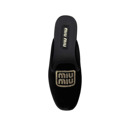 Mules Miu Miu en cuir de veau noir