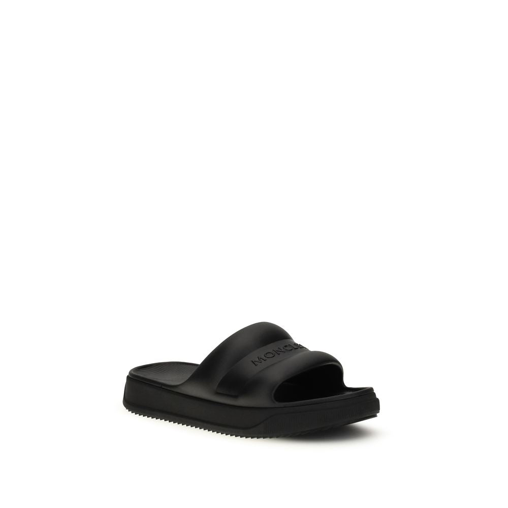 Sandales plates Moncler en caoutchouc noir
