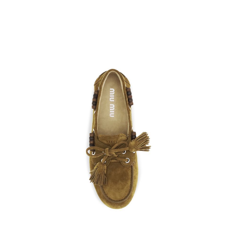 Mocassini slip-on Miu Miu in pelle di vitello beige Bos Taurus