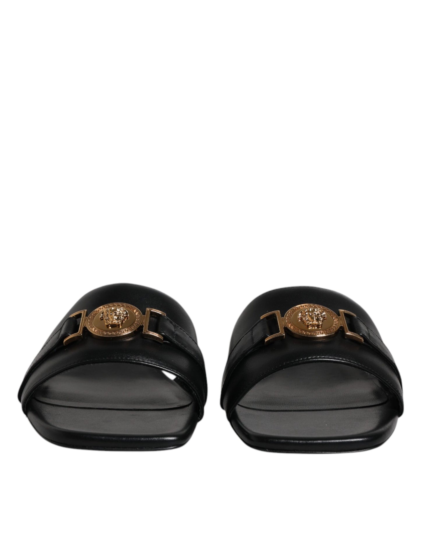 Sandales plates Versace en cuir noir avec plaque logo