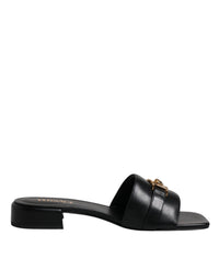 Sandales plates Versace en cuir noir avec plaque logo