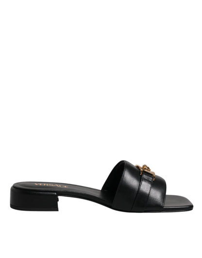 Sandales plates Versace en cuir noir avec plaque logo