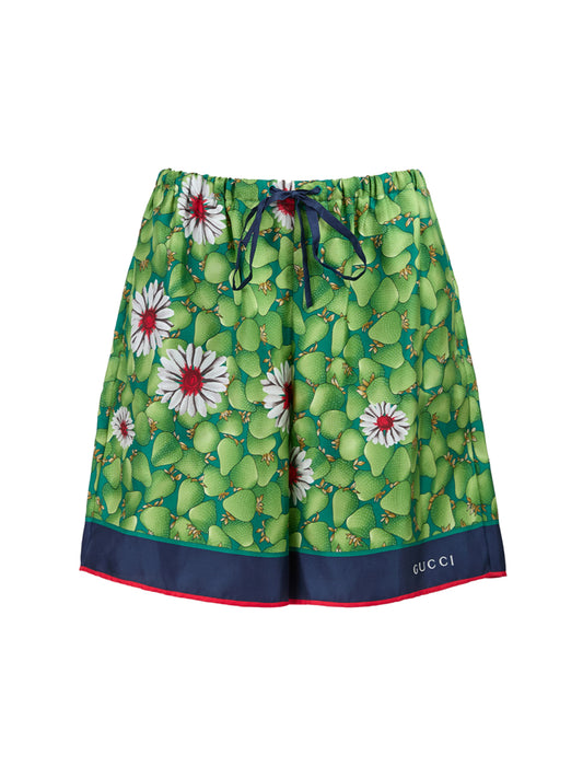 Pantaloncini in seta con stampa floreale verde Gucci