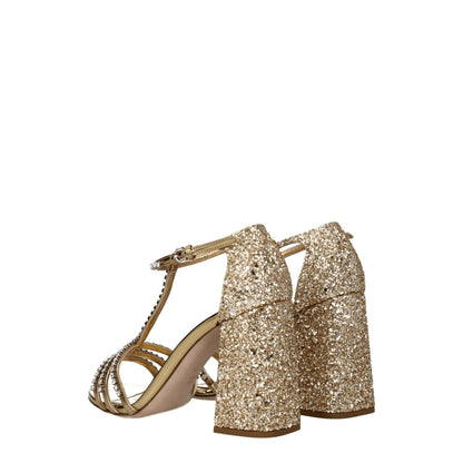 Sandali con plateau in plastica dorata Miu Miu