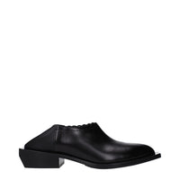 Mules in pelle nera Moschino