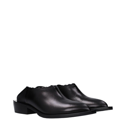 Mules in pelle nera Moschino
