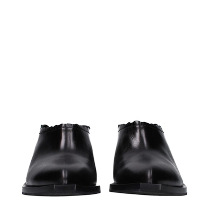 Mules in pelle nera Moschino