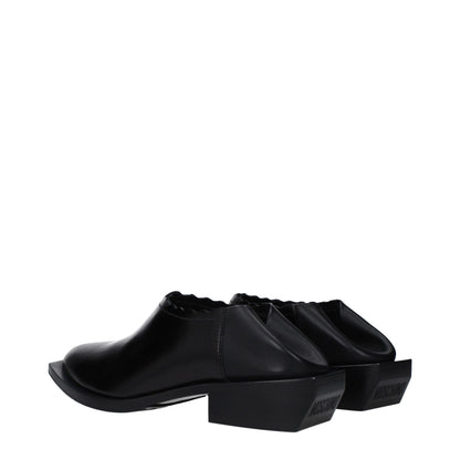 Mules in pelle nera Moschino