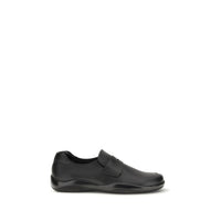 Mocassini slip-on Prada Bos Taurus in pelle di vitello nera